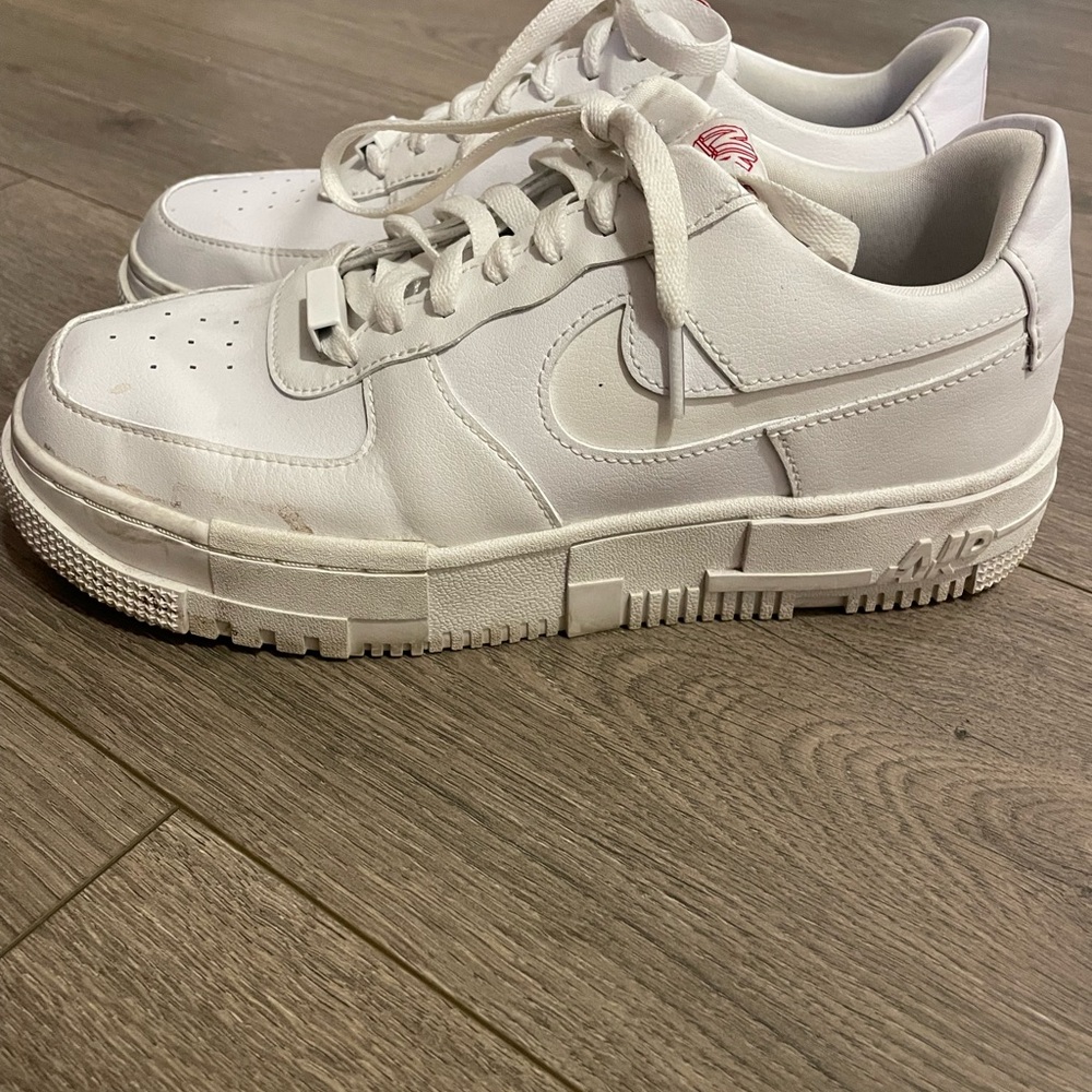 Womens white Nike Air Force 1 with red accents